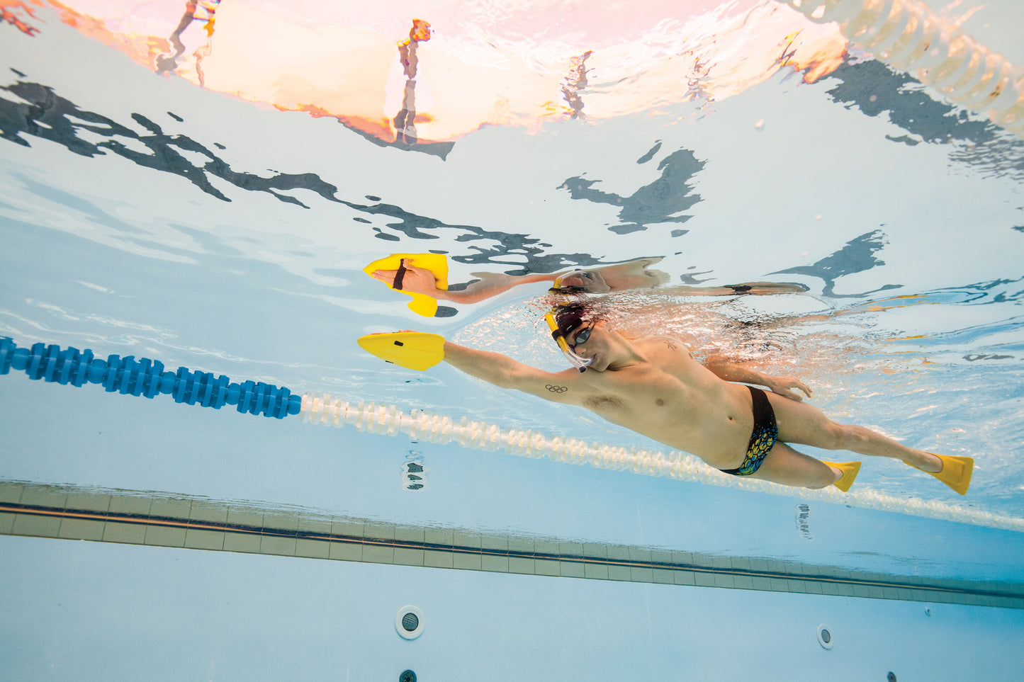 Streamlined swimming technique with FINIS Alignment Kickboard in pool