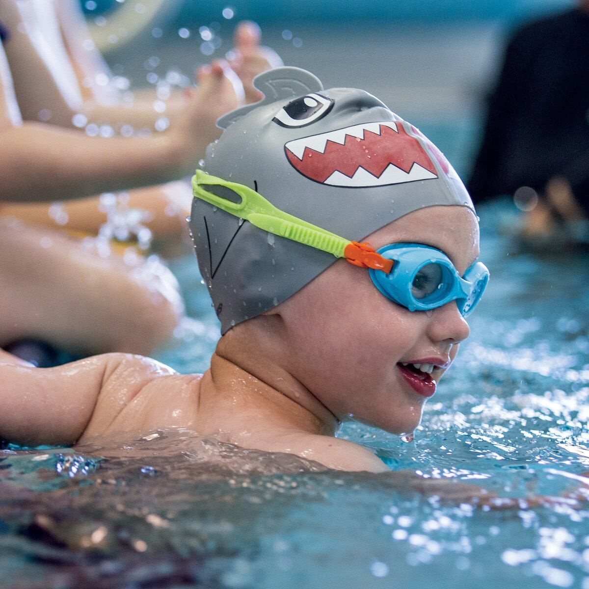 Child swimming with FINIS Animal Heads swim cap in Shark Grey, action view
