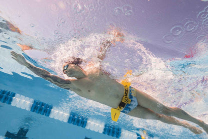 Swimmer wearing FINIS Hydro Hip underwater to train hip rotation and power
