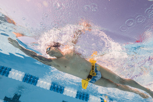 Swimmer wearing FINIS Hydro Hip underwater to train hip rotation and power