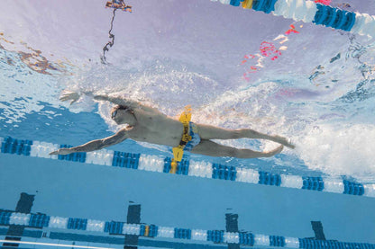 Side view of swimmer using FINIS Hydro Hip during freestyle stroke