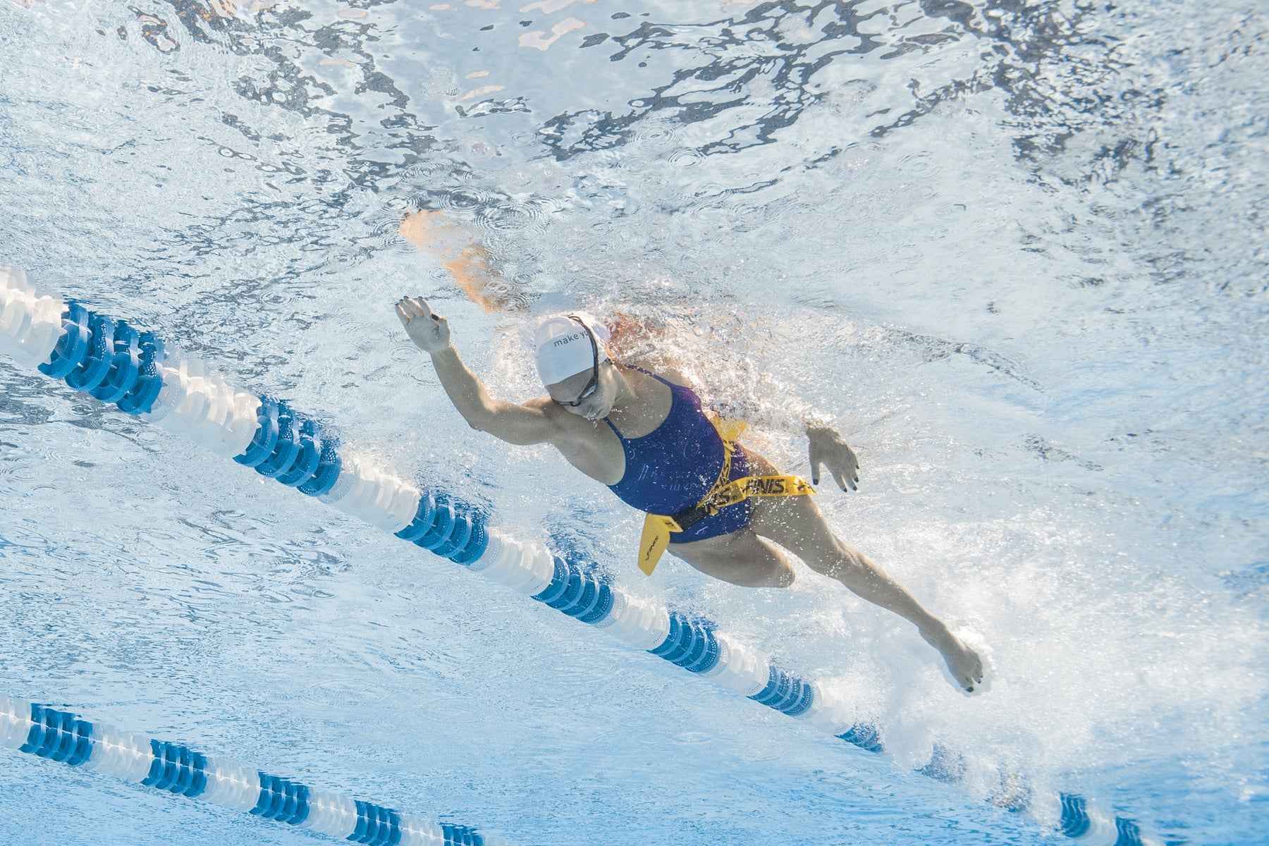 Top pool view of swimmer training with FINIS Hydro Hip resistance tool