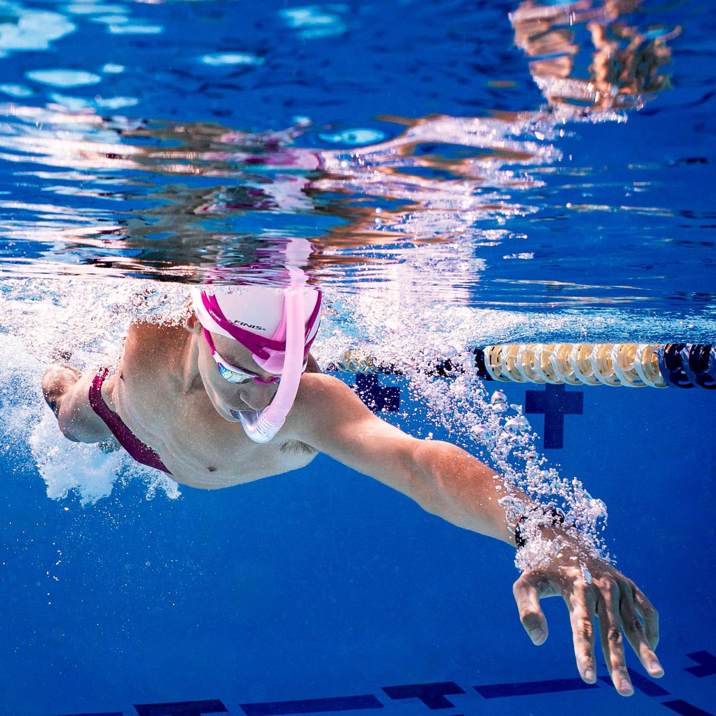 Competitive swimmer training with FINIS Stability Snorkel Orchid centre-mount design