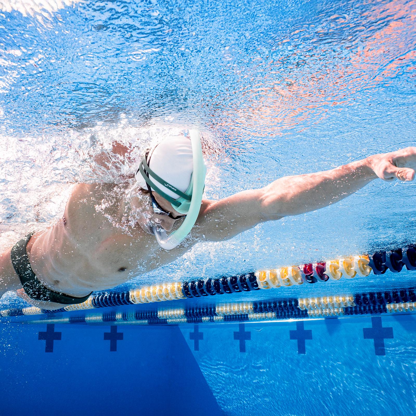 Swimmer using FINIS Stability Snorkel Sage during freestyle training to improve body alignment and stroke technique