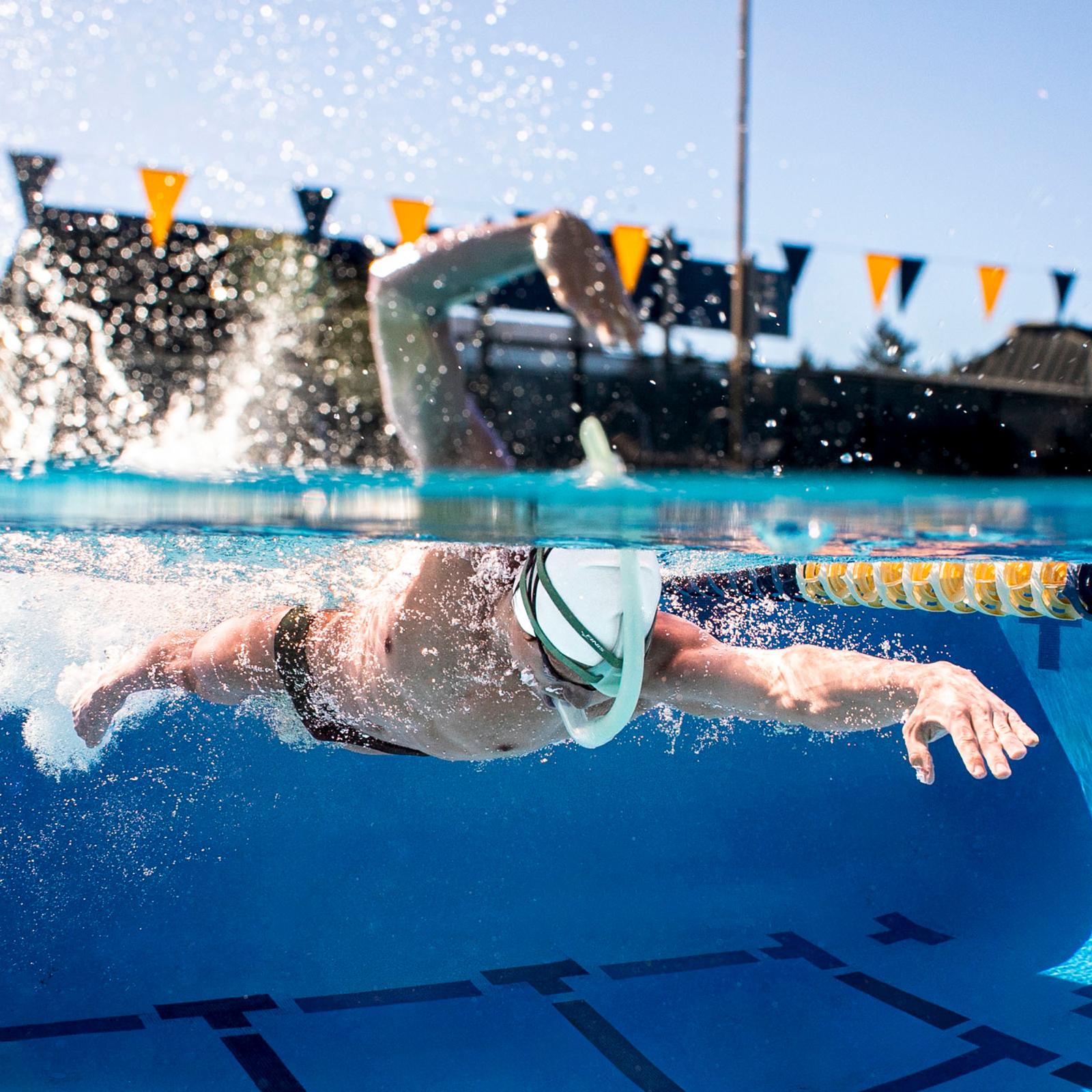 Swimmer using FINIS Stability Snorkel Sage to improve body alignment and stroke technique